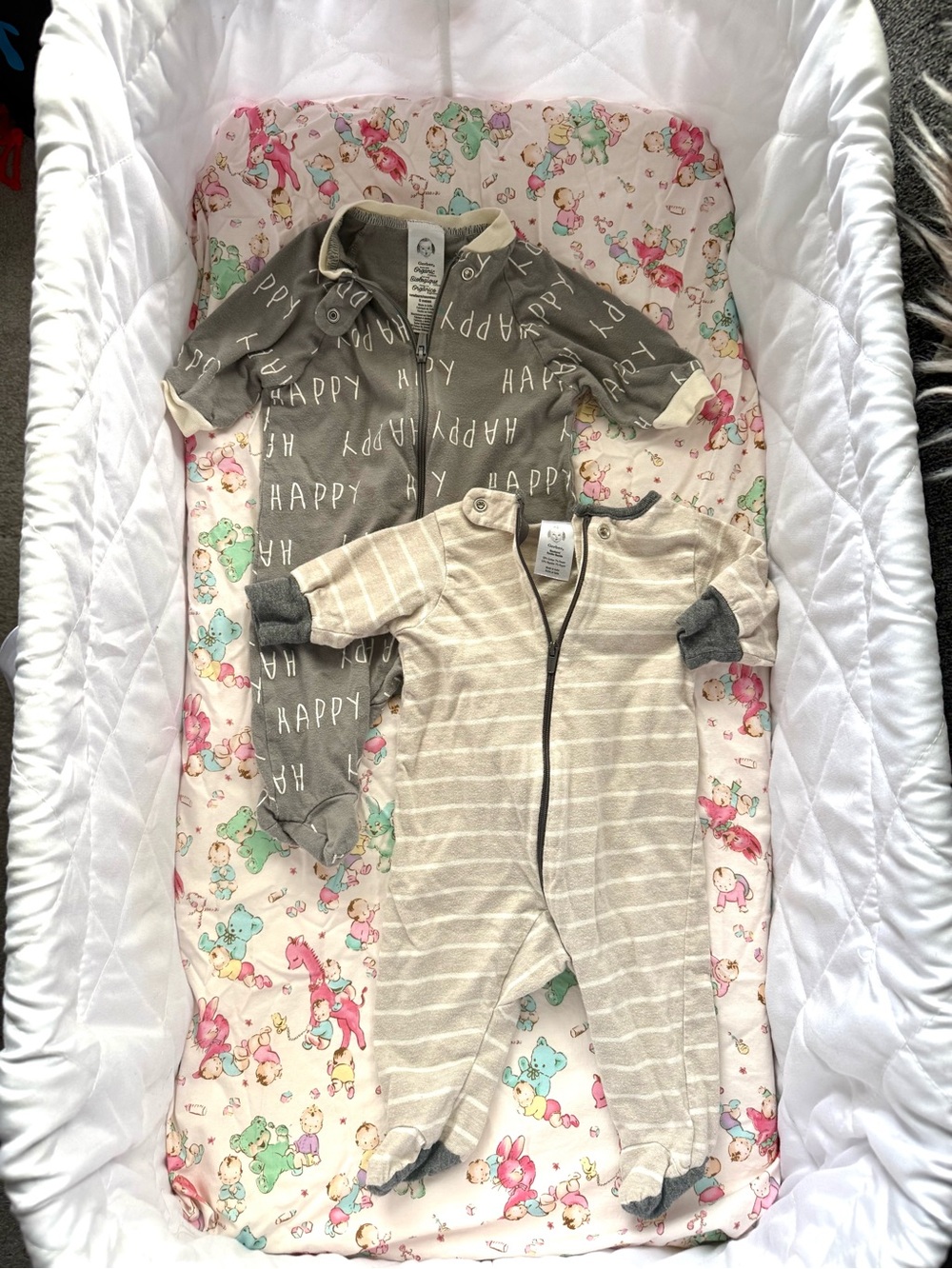 Gerber organic cotton Baby Zip Footed Pajamas and blue sleep sack